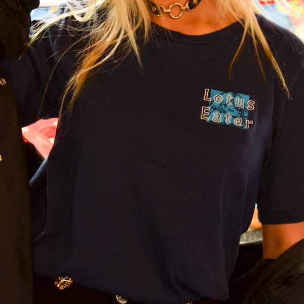 Lotus Eater Model Wearing Tops. Brand Logo Embroidery.