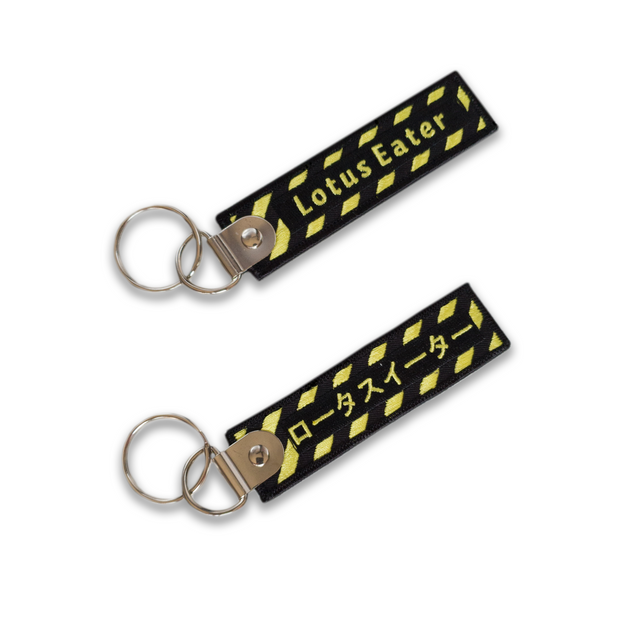 Lotus Eater Jet Tag Key Chain. Yellow Caution Style Brand with Japanese Design
